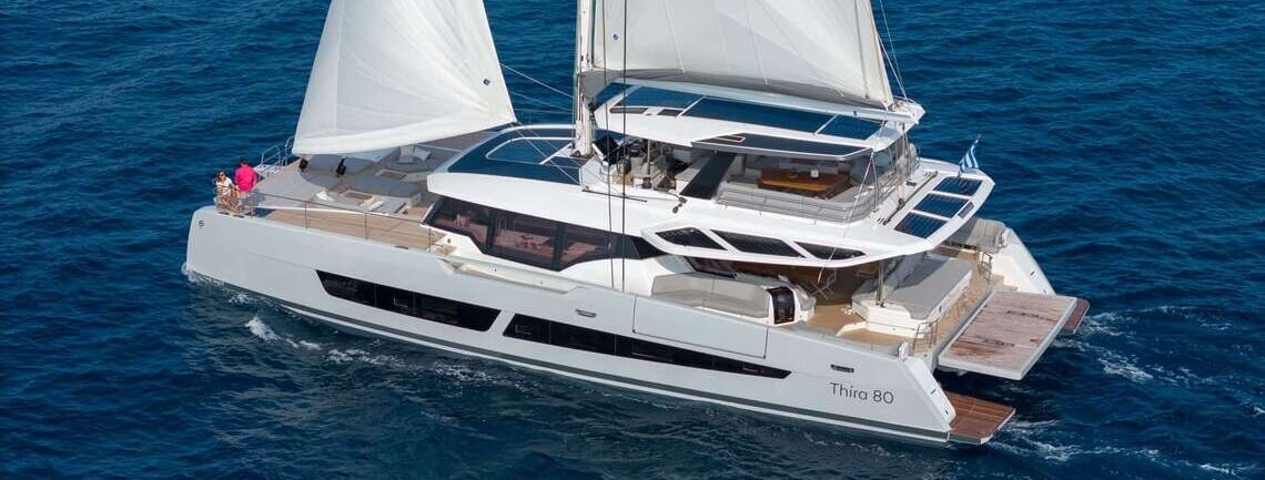 Fountaine Pajot Thíra 80 sailing catamaran seen from the aft quarter; image source Windward Yachts